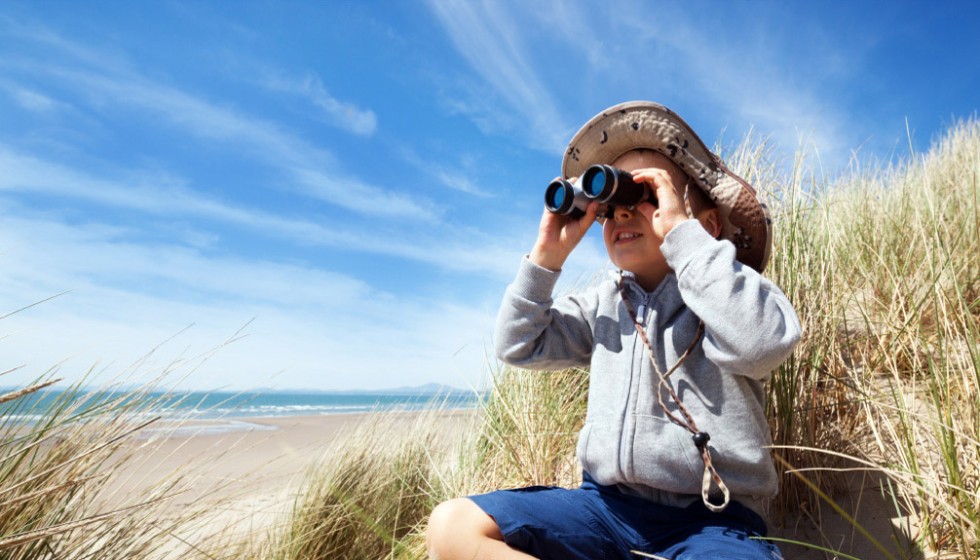 beach sea child binoculars dunes